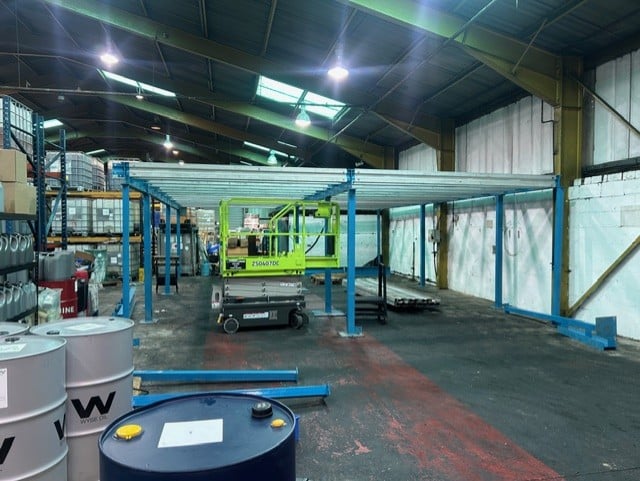 Chemical storage container facility at Midland Oil Group Halesowen showing oil drums and industrial warehouse