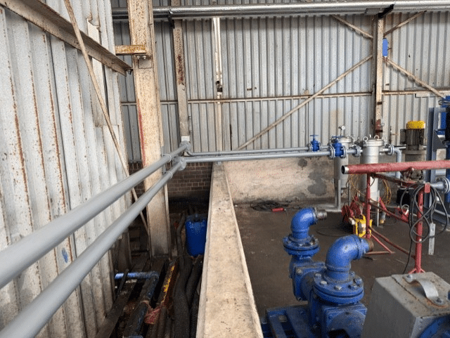 30000 litre base oil storage tanks inside Midland Oil Group engine oil blending warehouse